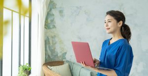 Portrait,Of,A,Young,Asian,Woman,In,A,Room.,Working