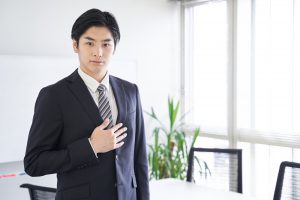 A,Japanese,Male,Businessman,Puts,His,Hand,On,His,Chest