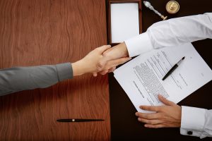 Woman,And,Notary,Public,Shaking,Hands