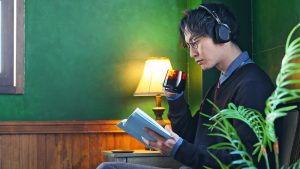 Asian,Man,Reading,A,Book,In,Luxury,Room.