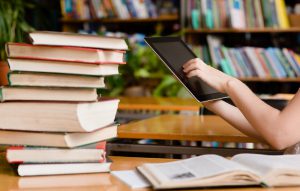 Hands,Using,Tablet,Computer,In,Library