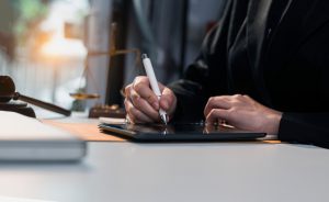 Justice,And,Law,Concept.,Lawyer,Business,Hands,Tablet,On,Tablet