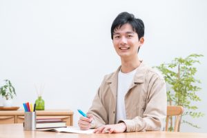 Young,Man,Studying,In,Room