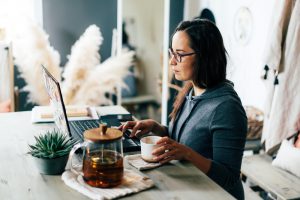 A,Brunette,In,Glasses,Works,On,A,Laptop.,Work,From