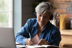 Diligent,Aged,Student.,Focused,Elderly,Hispanic,Woman,In,Headphones,Watch