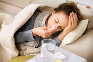 Sick,Woman.flu.woman,Caught,Cold.,Sneezing,Into,Tissue.,Headache.,Virus,.medicines