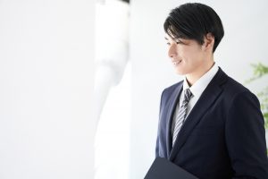 A,Japanese,Male,Businessman,Looks,Out,The,Window,With,A