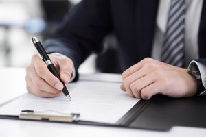 Japanese,Male,Businessman,On,Hand,To,Sign,Papers