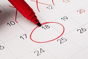 Calendar,Page,With,Red,Pen,Close,Up.,Focus,On,Number