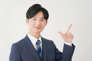 Asian,Businessman,Check,Mark,Gesture,In,White,Background