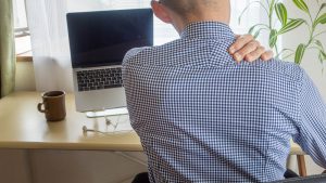 A,Man,With,Stiff,Shoulders,Working,From,Home