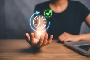 Woman,Holding,A,Holographic,Clock,And,Checkmark,,Symbolizing,Time,Management