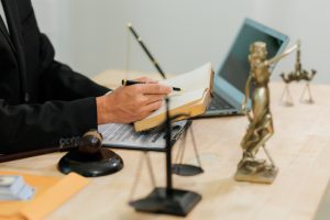 A,Statue,Of,Lady,Justice,And,A,Gavel,Rest,On