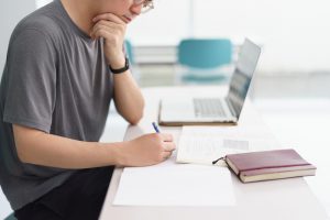 Man,Taking,Notes,During,Online,Professional,Certification,Course